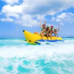 Banana Boat Abu Dhabi fun water activity with group riding inflatable banana boat