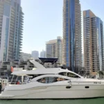 55 ft Majesty yacht cruising in Dubai Marina skyline
