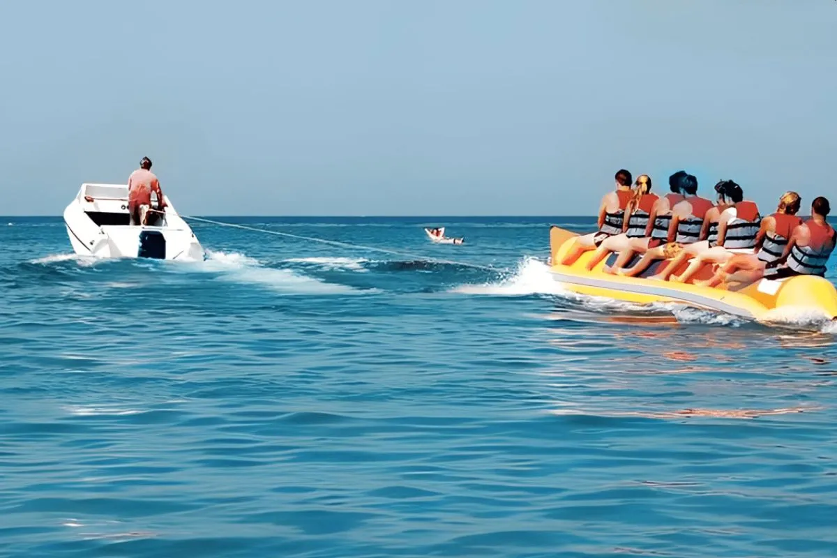Family-friendly water activities Abu Dhabi banana ride with professional supervision