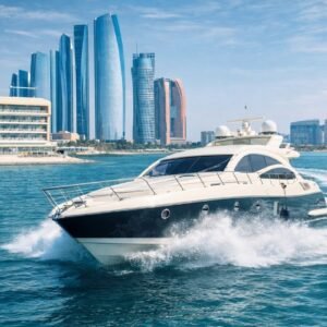 Luxury yacht cruising at high speed in Abu Dhabi waters near city skyline