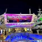 Luxury hospitality yacht in Abu Dhabi with colorful night lighting and a live performance during Formula 1 events at Yas Marina