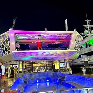 Luxury hospitality yacht in Abu Dhabi with colorful night lighting and a live performance during Formula 1 events at Yas Marina