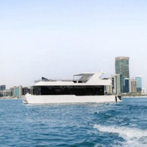 Amber Regent yacht cruising past the Abu Dhabi skyline, Abu Dhabi